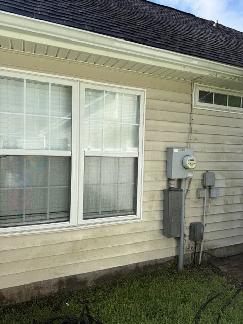 House before — wide angle showing streaks